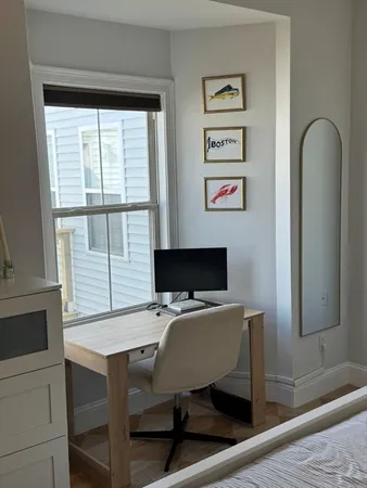 a workspace with furniture and window