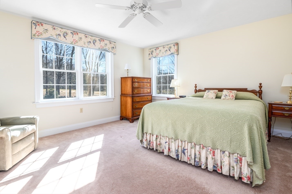 17 Coleman Road Newbury, MA 01922 - Photo 23 of 42 a bedroom with a bed and a window