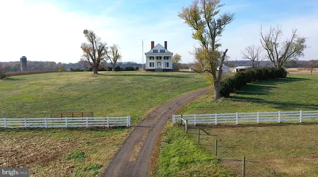 a view of a swimming pool with a yard