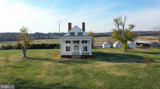 a view of house with outdoor space and porch