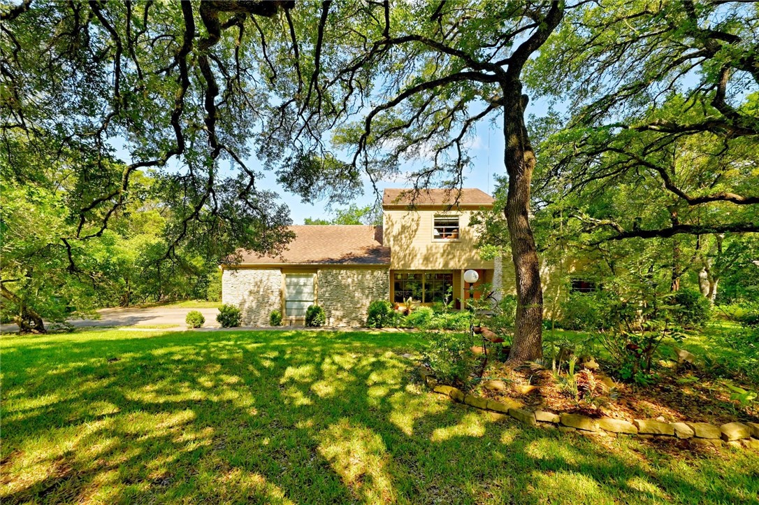 2204 Toro Canyon Road Austin, TX 78746 - Photo 1 of 1 Front of home with beautiful trees