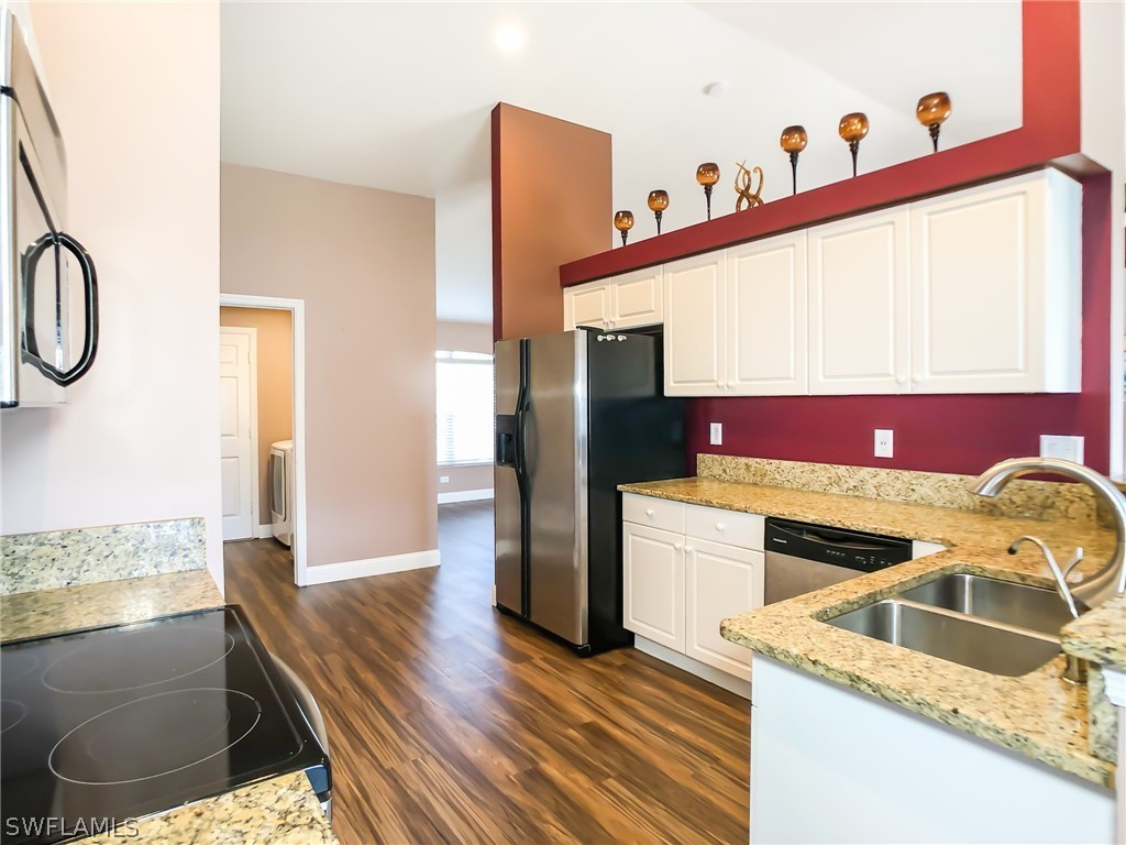9068 Morris Road Fort Myers, FL 33967 - Photo 12 of 29 a kitchen with a refrigerator sink and stove