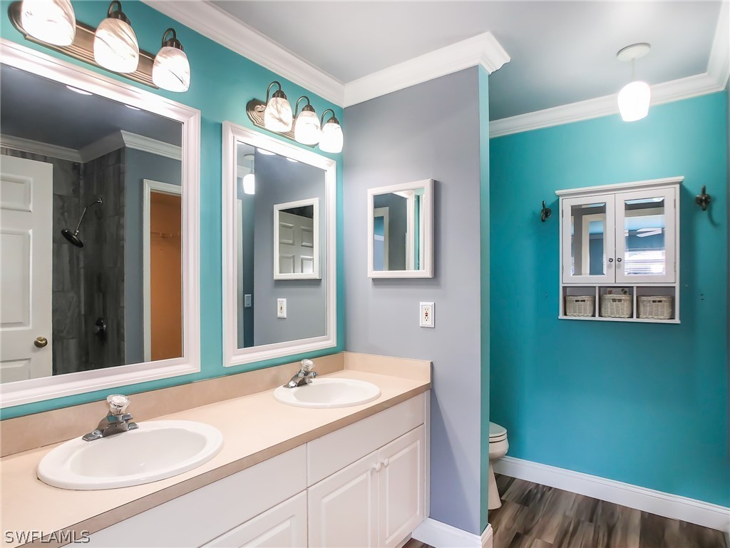 9068 Morris Road Fort Myers, FL 33967 - Photo 17 of 29 a bathroom with a sink and a mirror