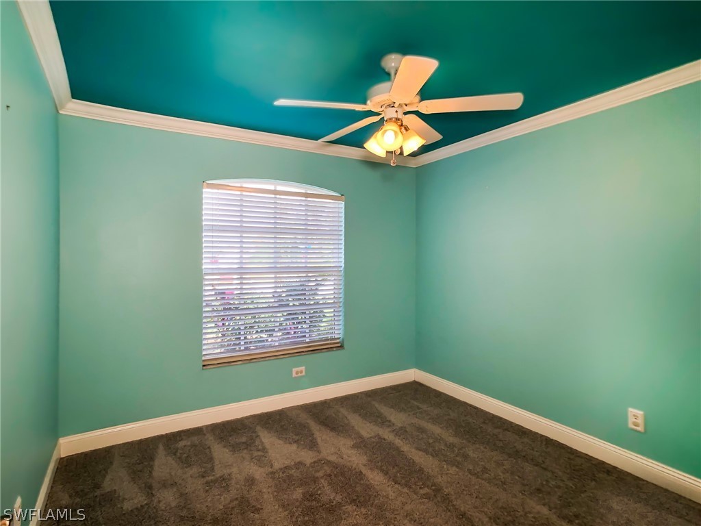 9068 Morris Road Fort Myers, FL 33967 - Photo 19 of 29 a view of an empty room with a window and a fan