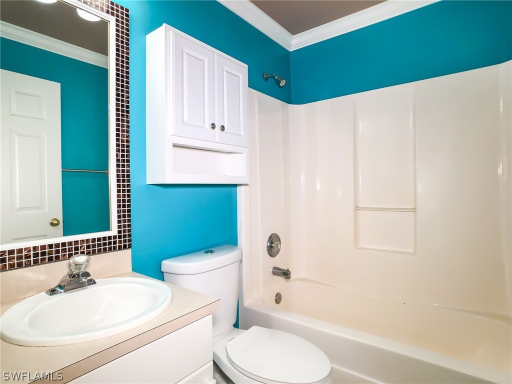 9068 Morris Road Fort Myers, FL 33967 - Photo 21 of 29 a bathroom with a sink toilet and shower
