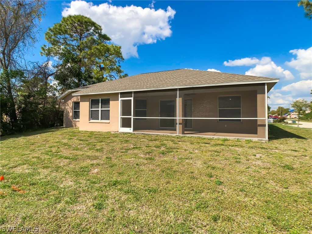 9068 Morris Road Fort Myers, FL 33967 - Photo 26 of 29 a view of a house with a yard