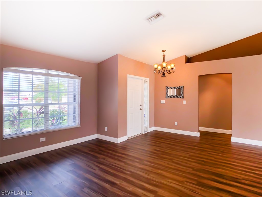 9068 Morris Road Fort Myers, FL 33967 - Photo 5 of 29 a view of a livingroom with wooden floor and a large window