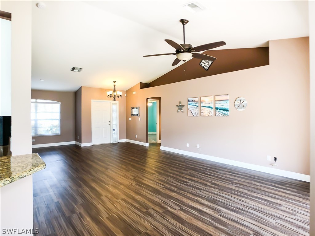 9068 Morris Road Fort Myers, FL 33967 - Photo 6 of 29 a view of an empty room with wooden floor and a window