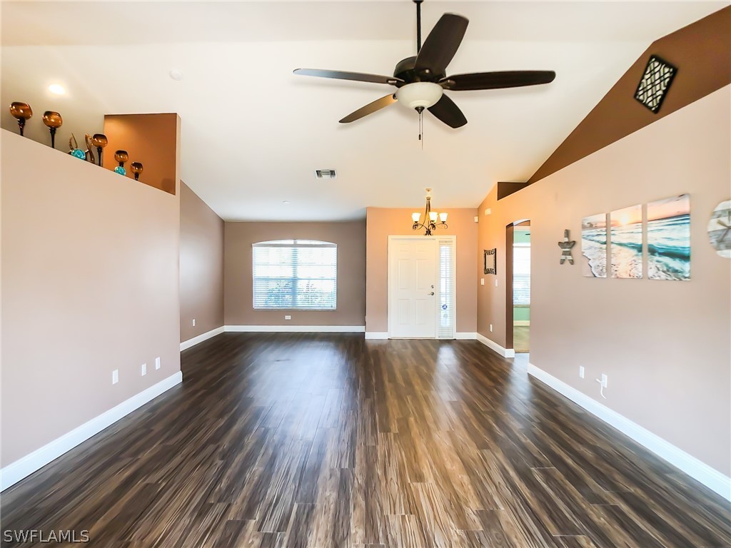 9068 Morris Road Fort Myers, FL 33967 - Photo 7 of 29 a view of a livingroom with wooden floor and a ceiling fan