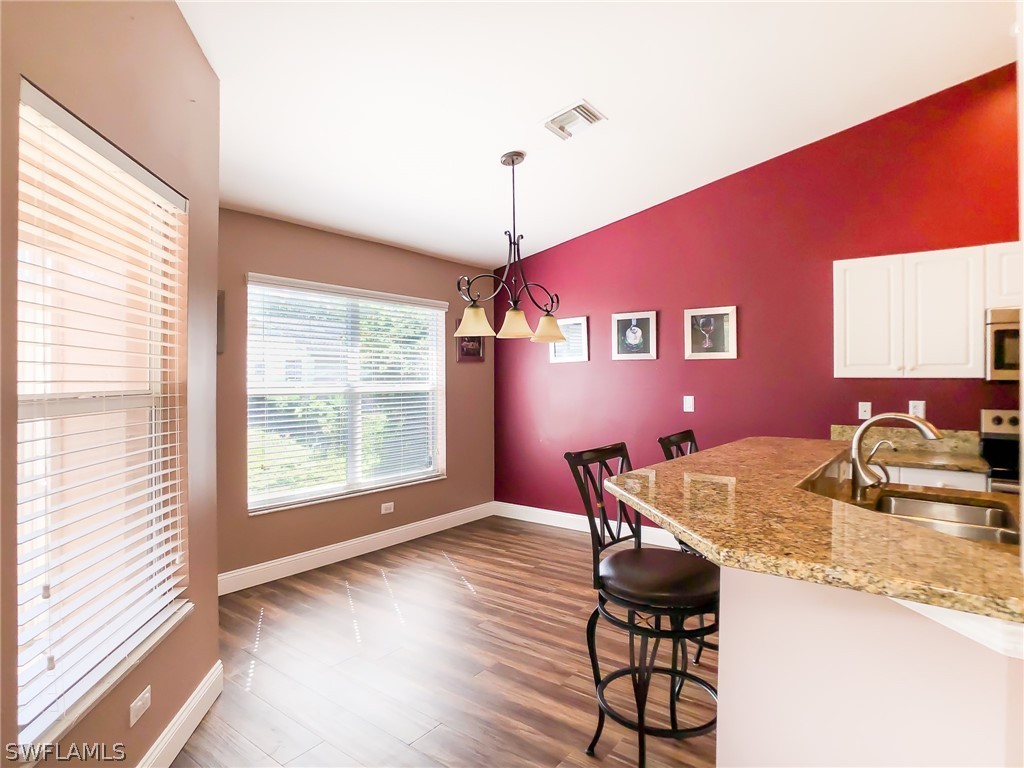 9068 Morris Road Fort Myers, FL 33967 - Photo 8 of 29 a dining room with furniture and window