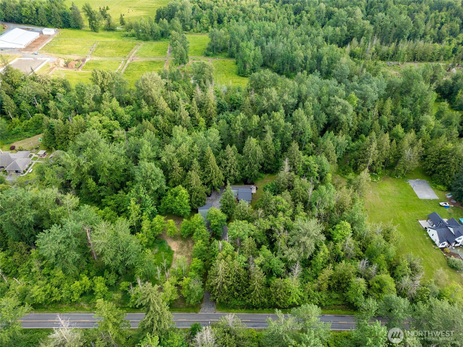 1535 Ten Mile Road Everson, WA 98247 - Photo 4 of 40 an aerial view of residential houses with outdoor space and trees