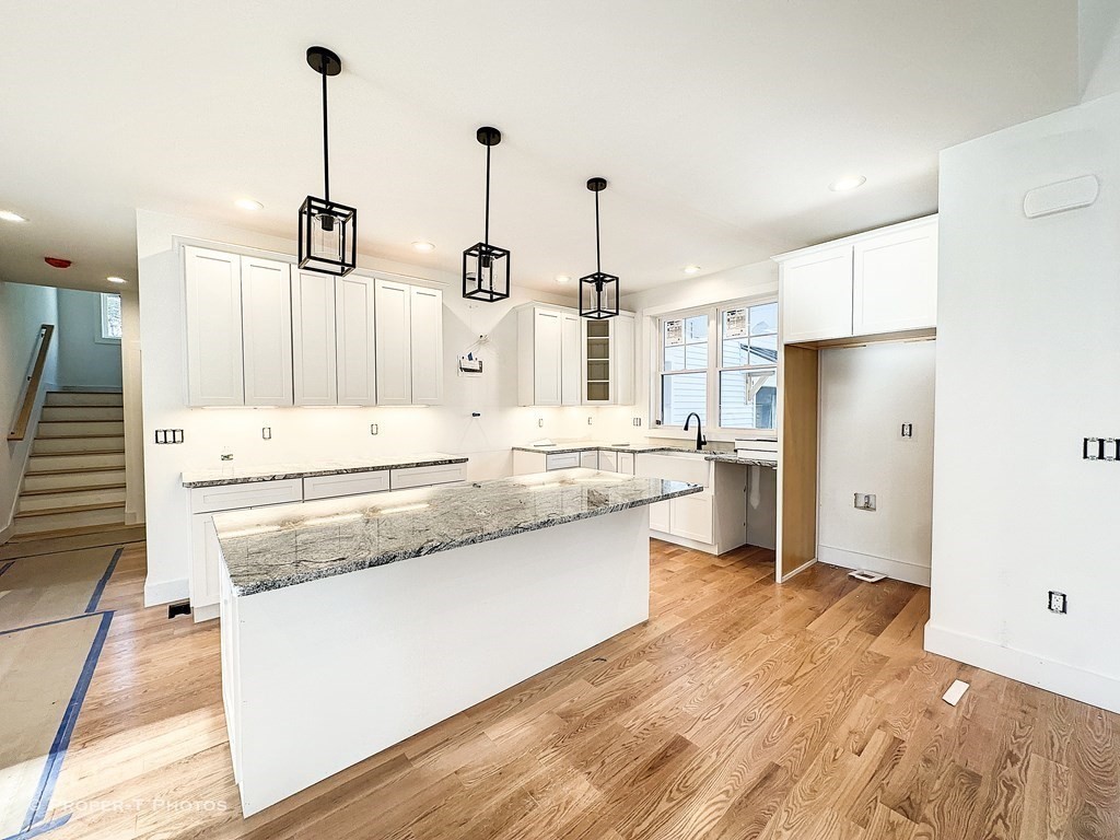101 Glendale Road Hampden, MA 01036 - Photo 11 of 39 a large kitchen with stainless steel appliances kitchen island granite countertop a refrigerator a sink and white cabinets