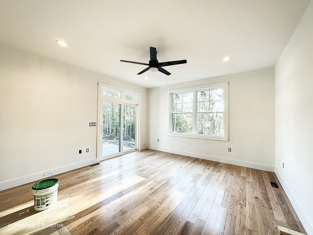 101 Glendale Road Hampden, MA 01036 - Photo 18 of 39 a view of empty room with wooden floor and fan