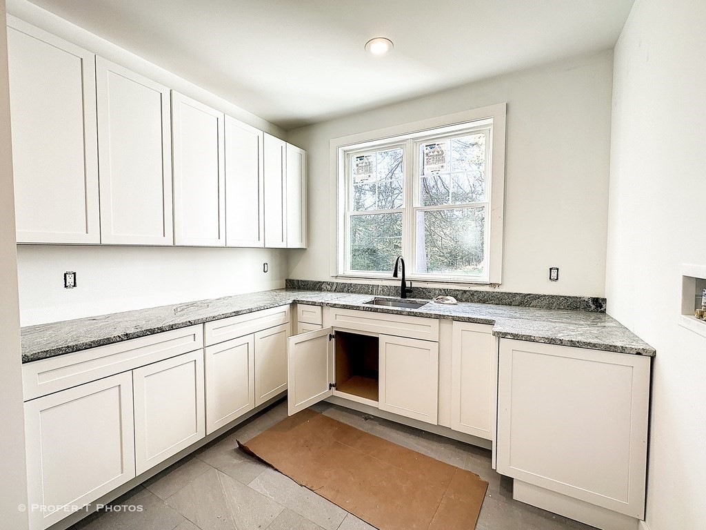 101 Glendale Road Hampden, MA 01036 - Photo 24 of 39 a kitchen with granite countertop stainless steel appliances white cabinets sink and a large window
