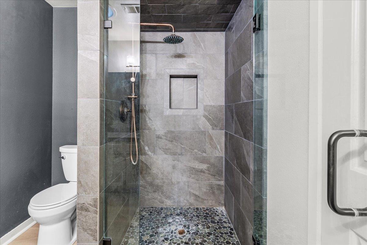 118 Nissen Road, Unit 1 Salinas, CA 93901 - Photo 22 of 39 a bathroom with a toilet and a shower