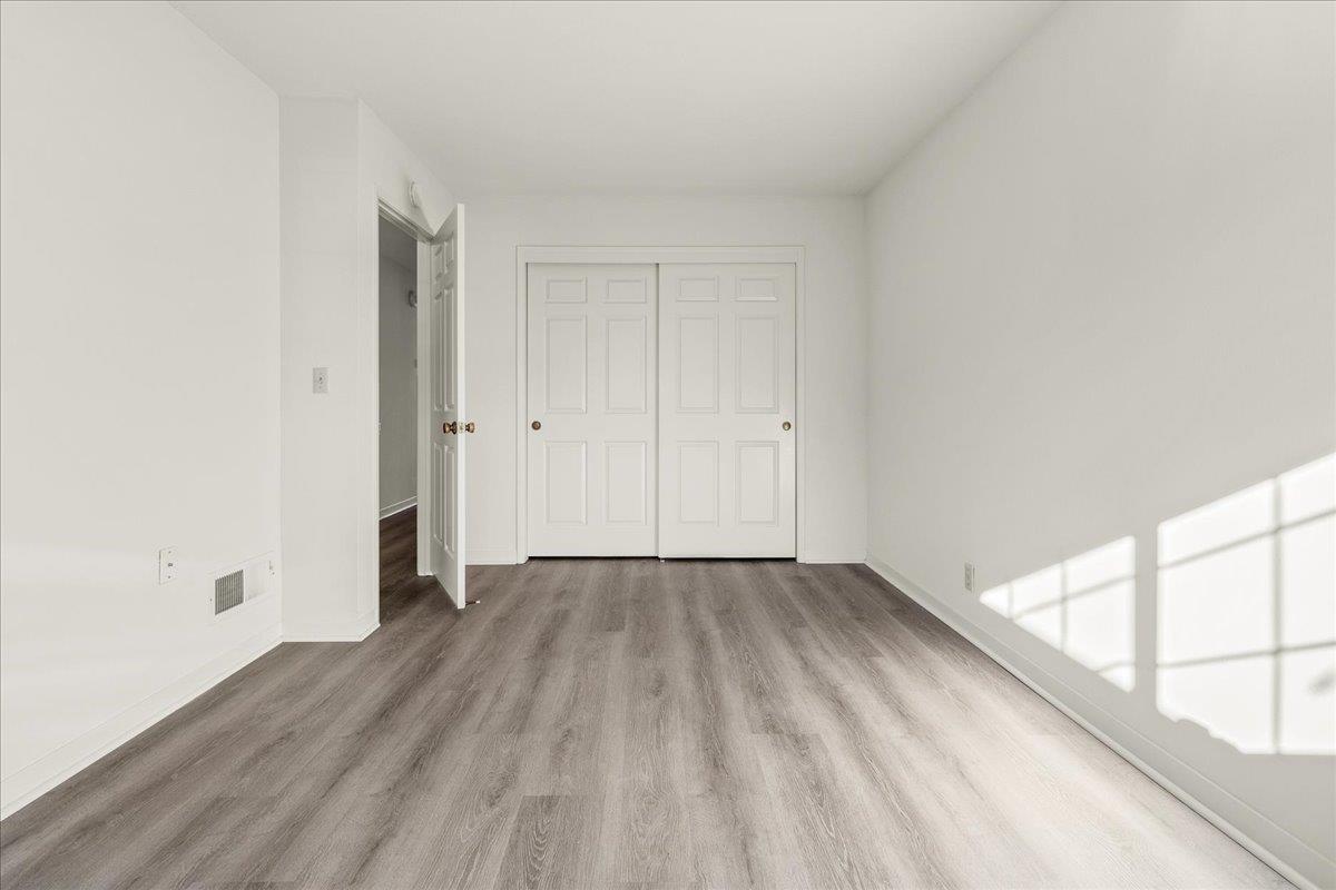 118 Nissen Road, Unit 1 Salinas, CA 93901 - Photo 24 of 39 a view of an empty room with wooden floor and a window