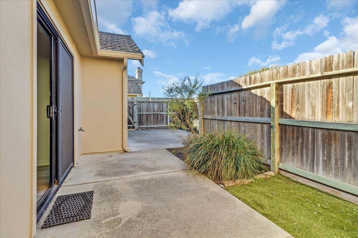118 Nissen Road, Unit 1 Salinas, CA 93901 - Photo 31 of 39 a view of a house with a small yard and floor to ceiling window and wooden fence