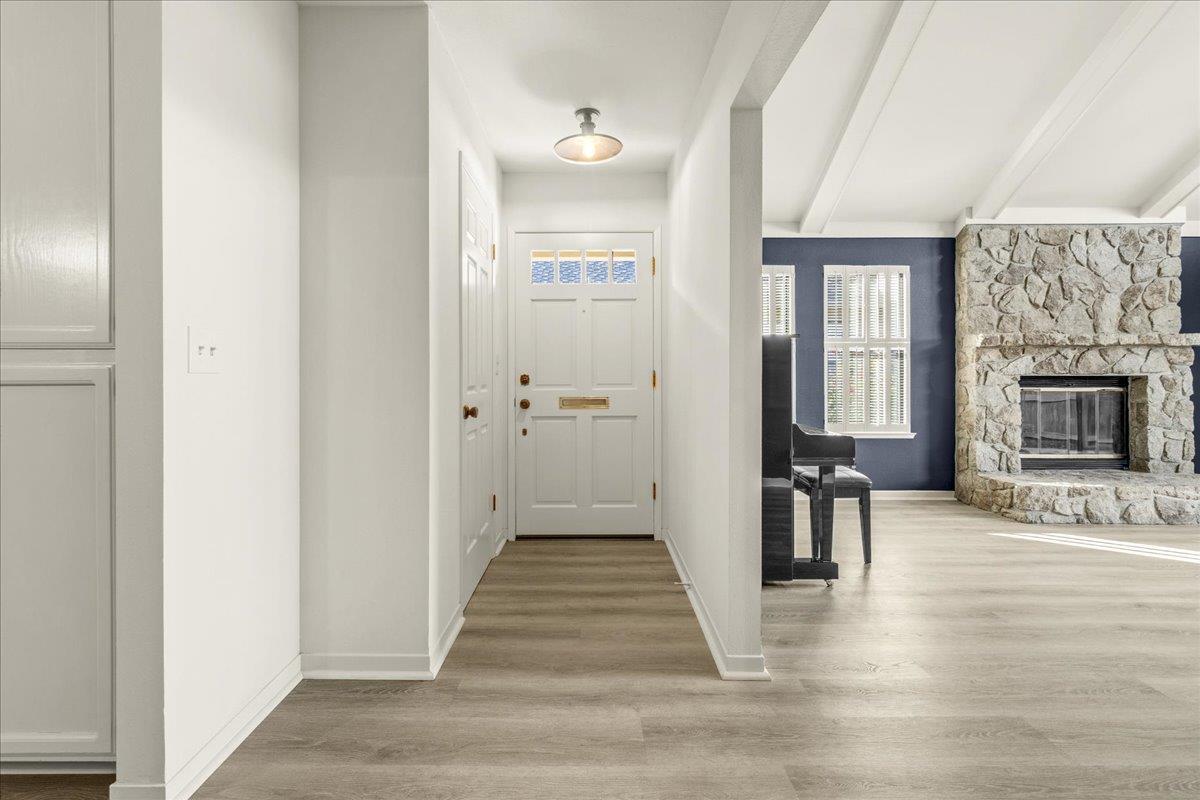 118 Nissen Road, Unit 1 Salinas, CA 93901 - Photo 6 of 39 a view of a livingroom with wooden floor and kitchen space with a sink