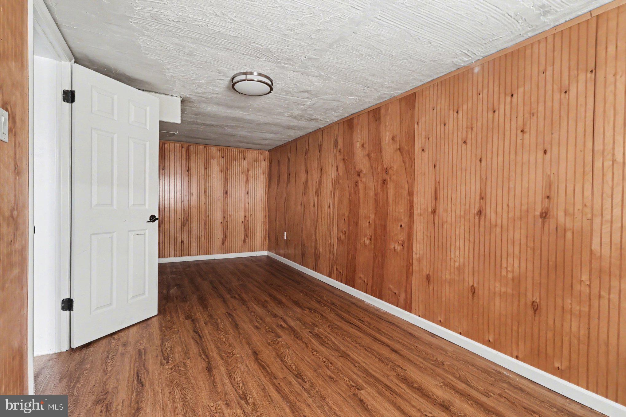 798 Bennington Road Folcroft, PA 19032 - Photo 23 of 28 a view of an empty room with wooden floor