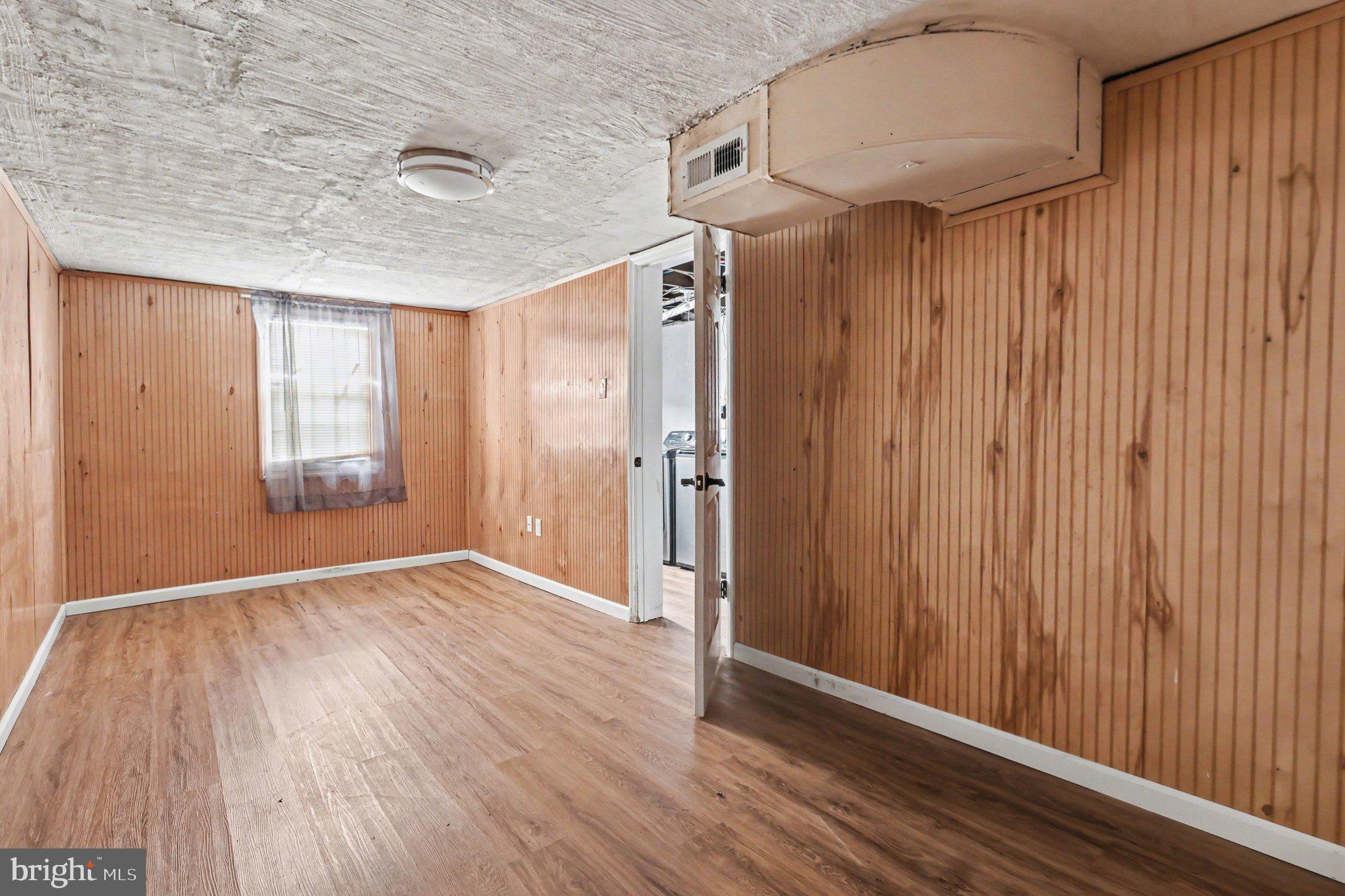 798 Bennington Road Folcroft, PA 19032 - Photo 24 of 28 an empty room with wooden floor and windows