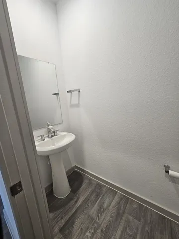 a bathroom with a sink and mirror