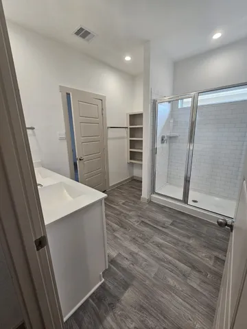 wooden floor in an empty room with an entrance