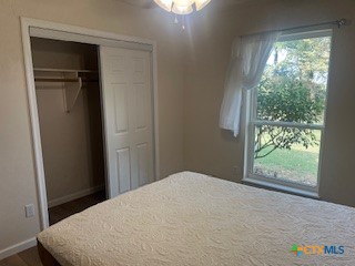 2603 West Main Street Cameron, TX 76520 - Photo 16 of 26 a bedroom with a bed and a window