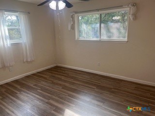 2603 West Main Street Cameron, TX 76520 - Photo 18 of 26 a view of an empty room with wooden floor and a window