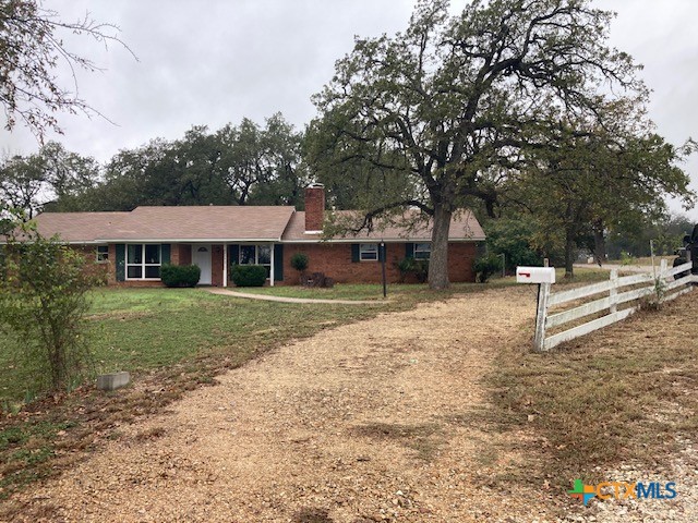 2603 West Main Street Cameron, TX 76520 - Photo 3 of 26 a front view of a house with a yard