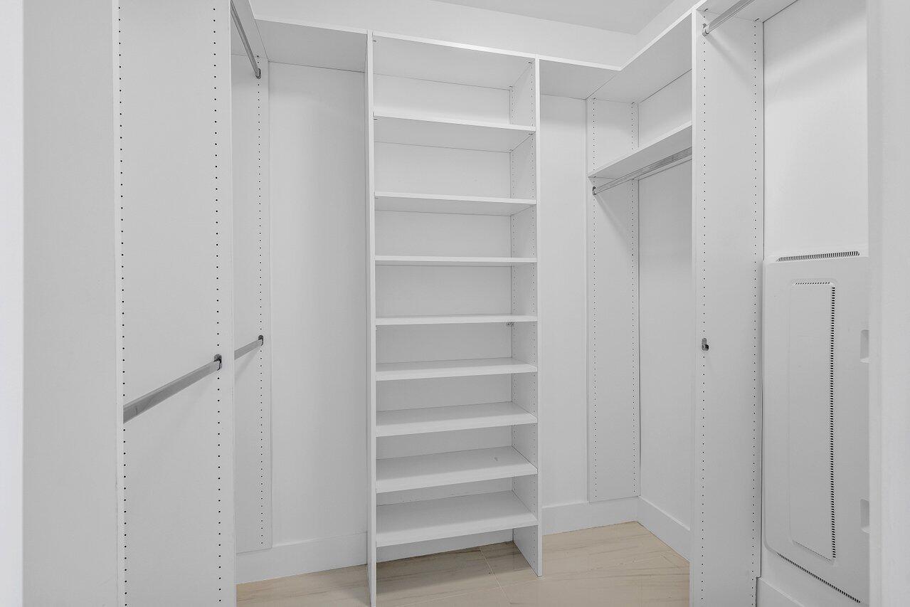 155 East Boca Raton Road, Unit 919 Boca Raton, FL 33432 - Photo 19 of 45 a view of walk in closet with empty racks