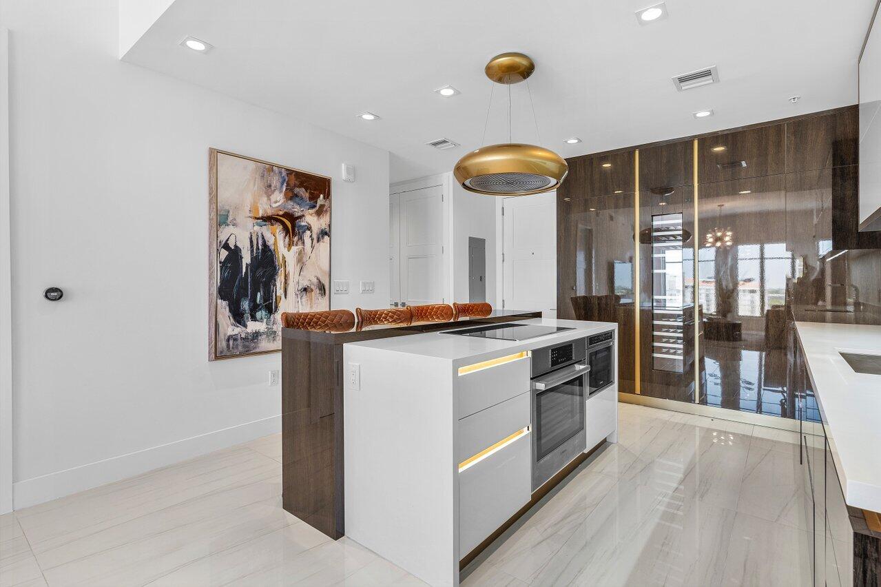 155 East Boca Raton Road, Unit 919 Boca Raton, FL 33432 - Photo 6 of 45 a kitchen with stainless steel appliances granite countertop a stove and a sink