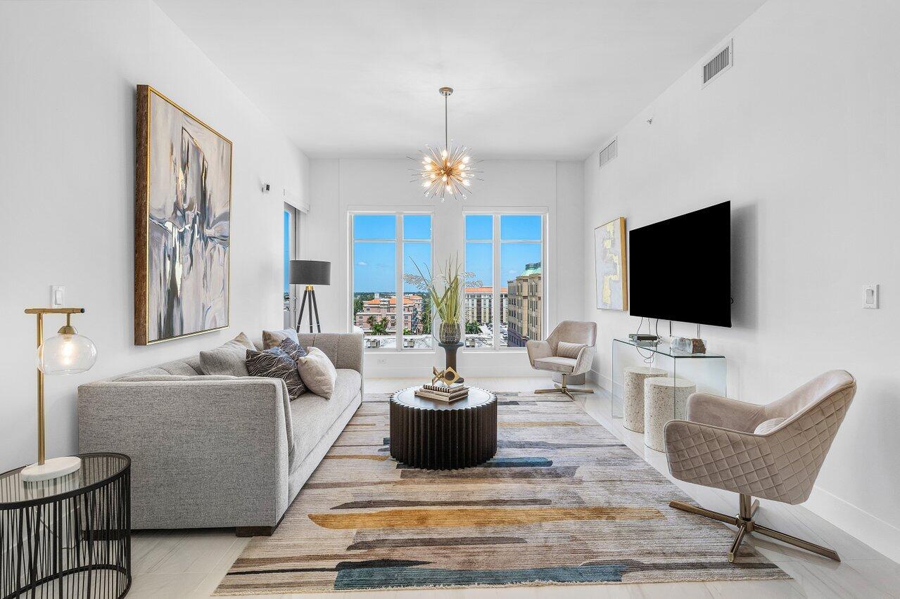 155 East Boca Raton Road, Unit 919 Boca Raton, FL 33432 - Photo 8 of 45 a living room with furniture a flat screen tv and a view of living room