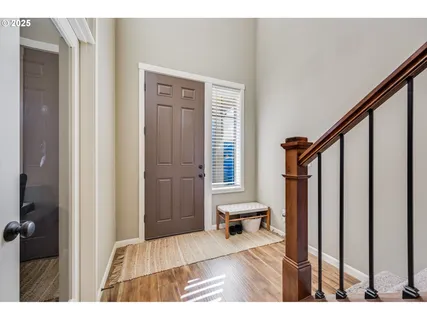 a view of an entryway with wooden floor