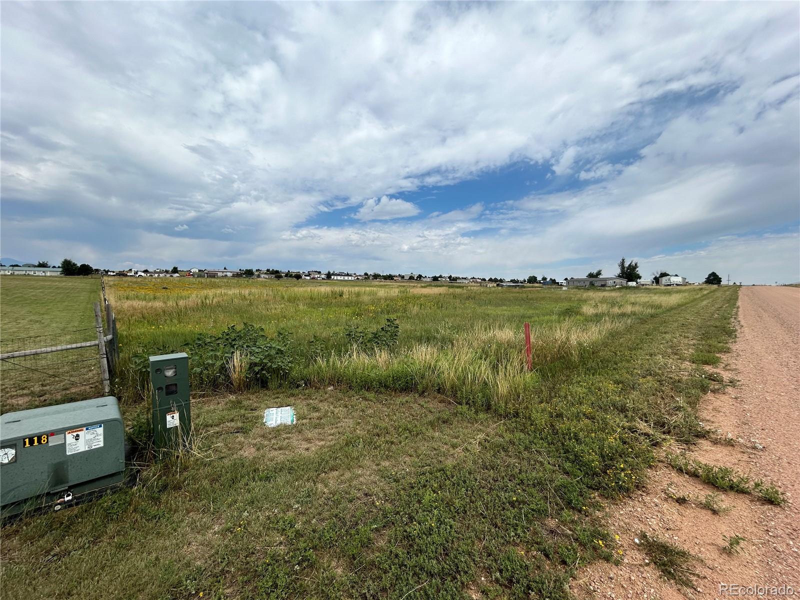 3640 Murr Road Peyton, CO 80831 - Photo 5 of 22 a view of a lake with a big yard