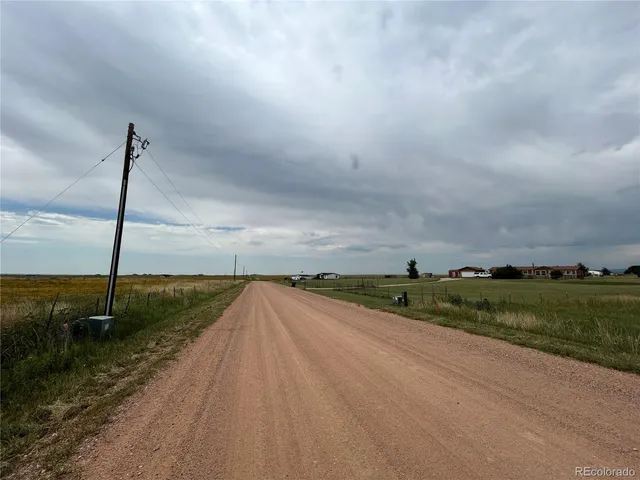 a view of a lake with houses in the back