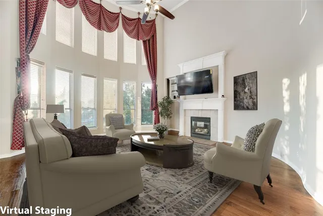 a bedroom with a bed and a large window with the outer view