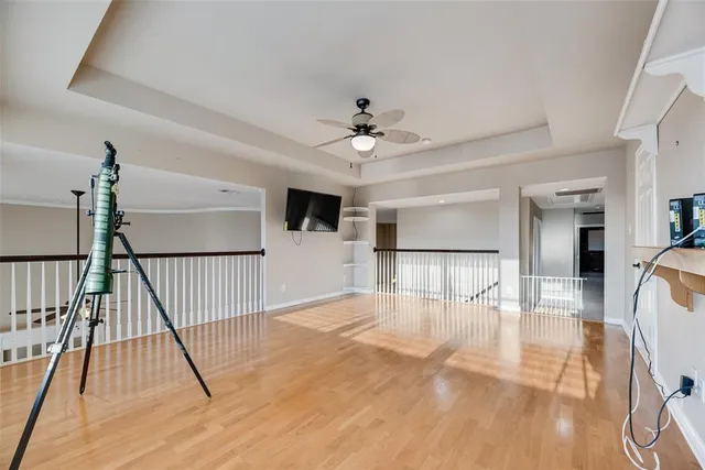 a view of livingroom with hardwood floor and ceiling fan