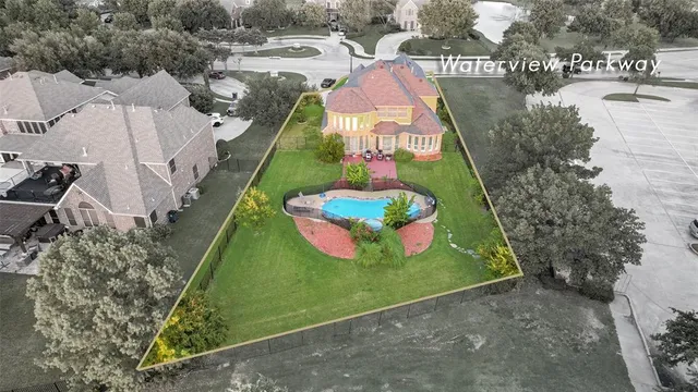 a view of a dining room with furniture wooden floor and chandelier
