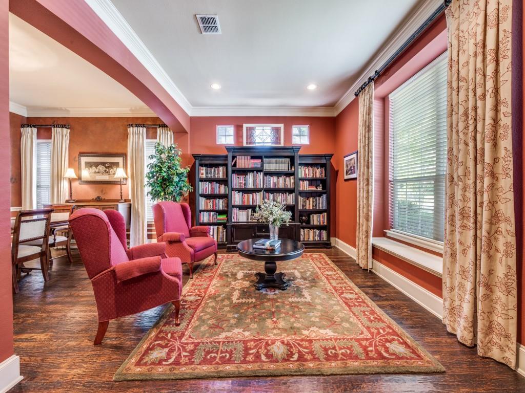 6470 Hunters Parkway Frisco, TX 75035 - Photo 12 of 40 Sitting room with crown molding, dark wood finished floors, arched walkways, and recessed lighting