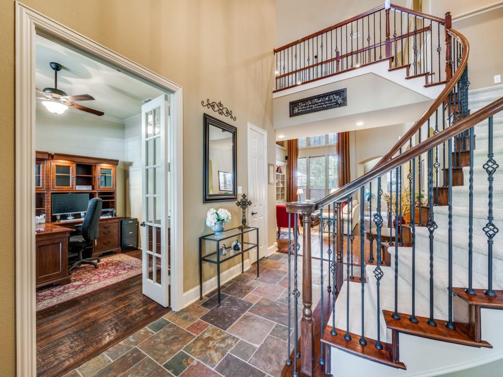 6470 Hunters Parkway Frisco, TX 75035 - Photo 18 of 40 Entryway with a towering ceiling, stone tile flooring, ceiling fan, and stairs