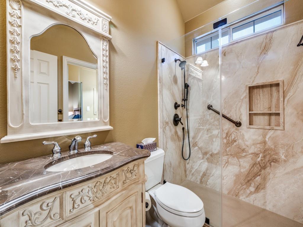 6470 Hunters Parkway Frisco, TX 75035 - Photo 28 of 40 Bathroom with a marble finish shower, vanity, and a textured wall