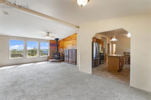 a view of a living room and entry way to room