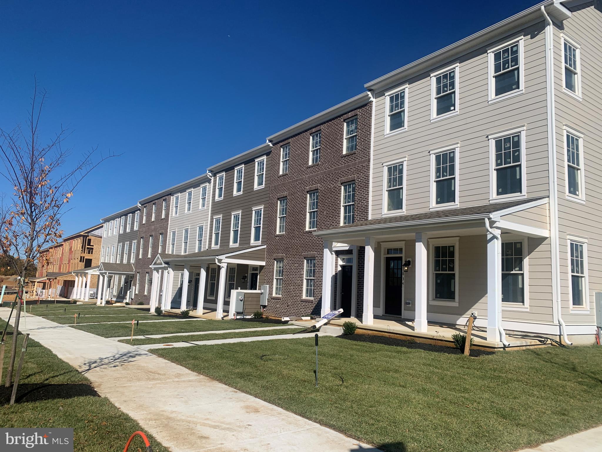 840 Mapleton Avenue, Unit 204 Middletown, DE 19709 - Photo 3 of 25 a front view of a building with a yard