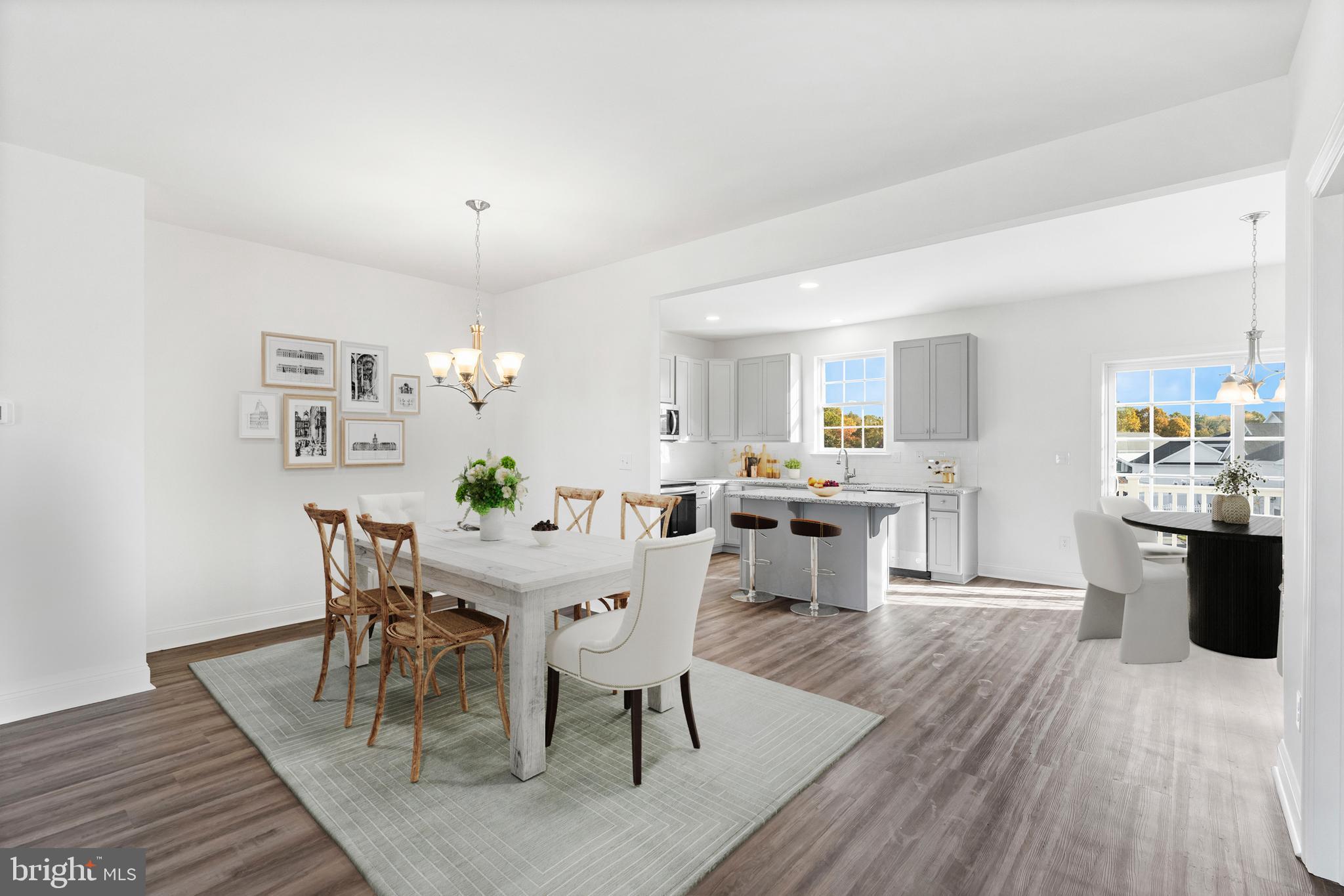 840 Mapleton Avenue, Unit 204 Middletown, DE 19709 - Photo 8 of 25 a view of a dining room with furniture and wooden floor