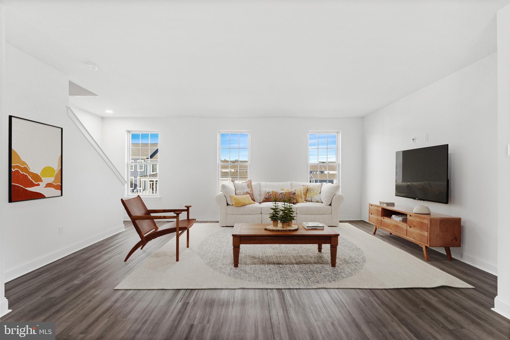 840 Mapleton Avenue, Unit 204 Middletown, DE 19709 - Photo 10 of 25 a living room with furniture and a flat screen tv