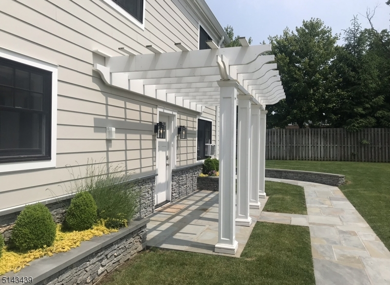 1 Union Avenue, Unit 3 Madison, NJ 07940 - Photo 2 of 12 a front view of a house with a yard