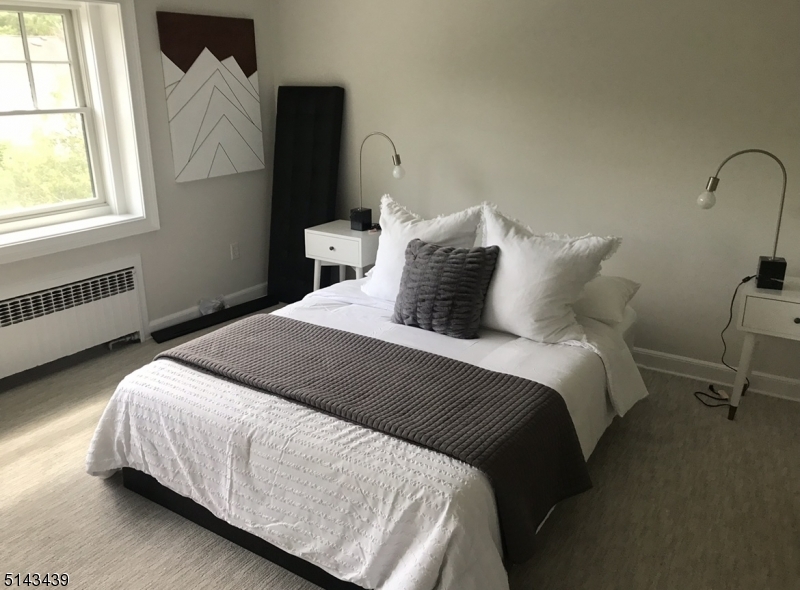 1 Union Avenue, Unit 3 Madison, NJ 07940 - Photo 6 of 12 a bedroom with bed and window
