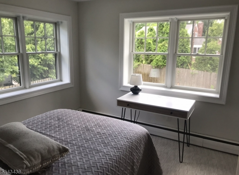 1 Union Avenue, Unit 3 Madison, NJ 07940 - Photo 7 of 12 a bedroom with a bed and a window