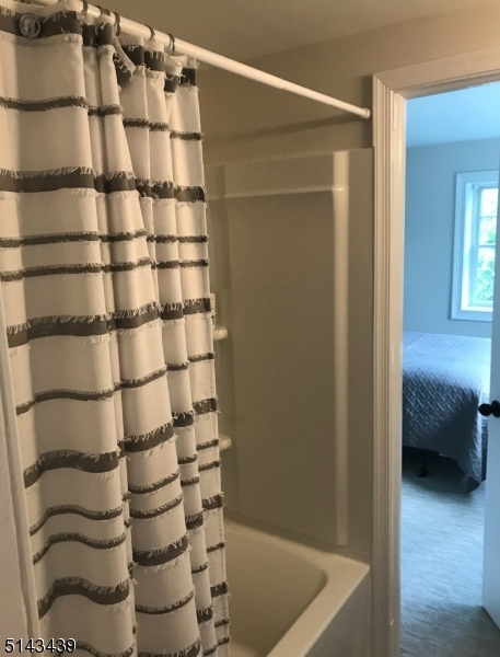 1 Union Avenue, Unit 3 Madison, NJ 07940 - Photo 9 of 12 a bathroom with a bathtub and shower