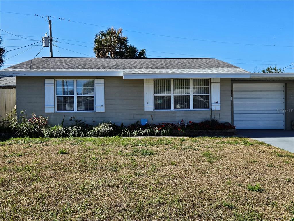 front view of a house with a yard